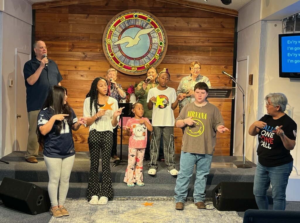 Youth and Family Ministry learning sign language at Unity of Arlington